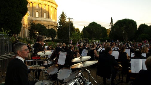A concert band plays outside the Orangery in the Italianate Garden at Ickworth